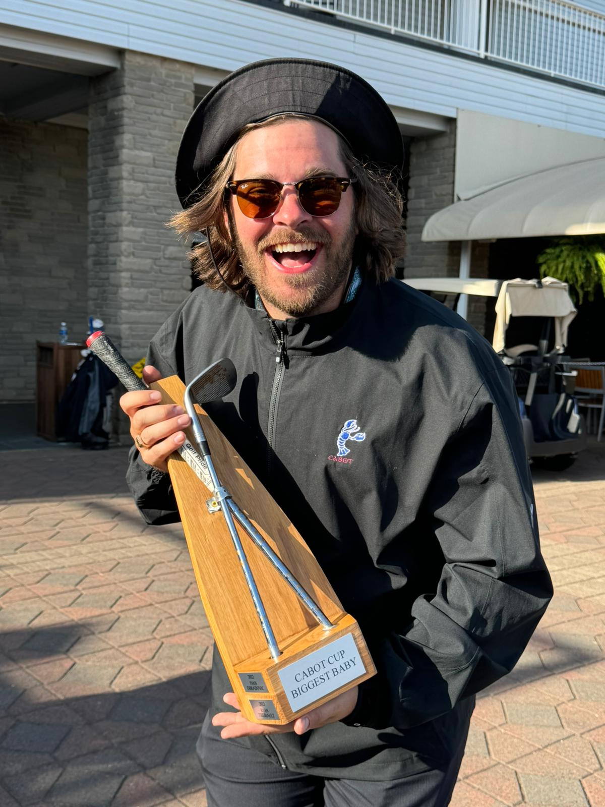 Mau accepting an award