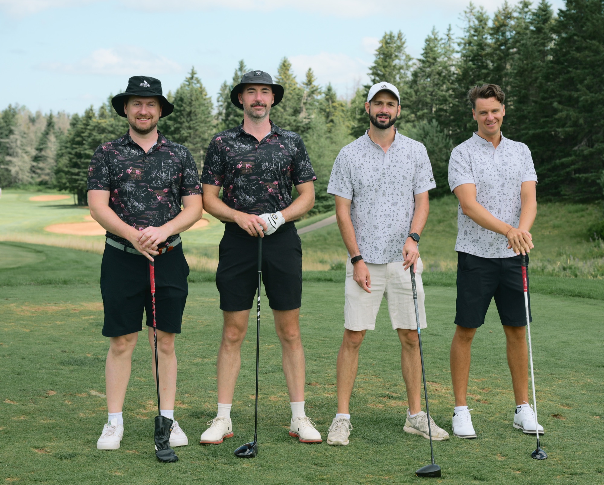 Two Flamingos and two Bears posing together on a tee