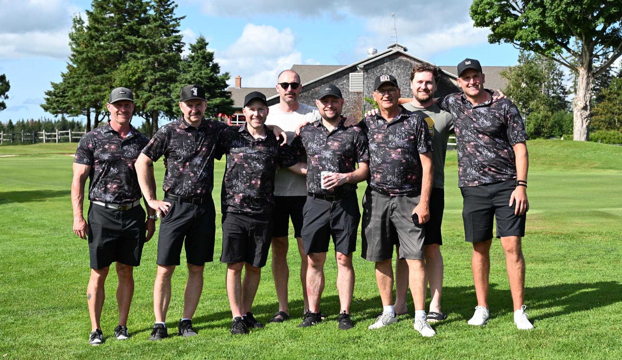 The Flamingos team lined up in their black and pink kit