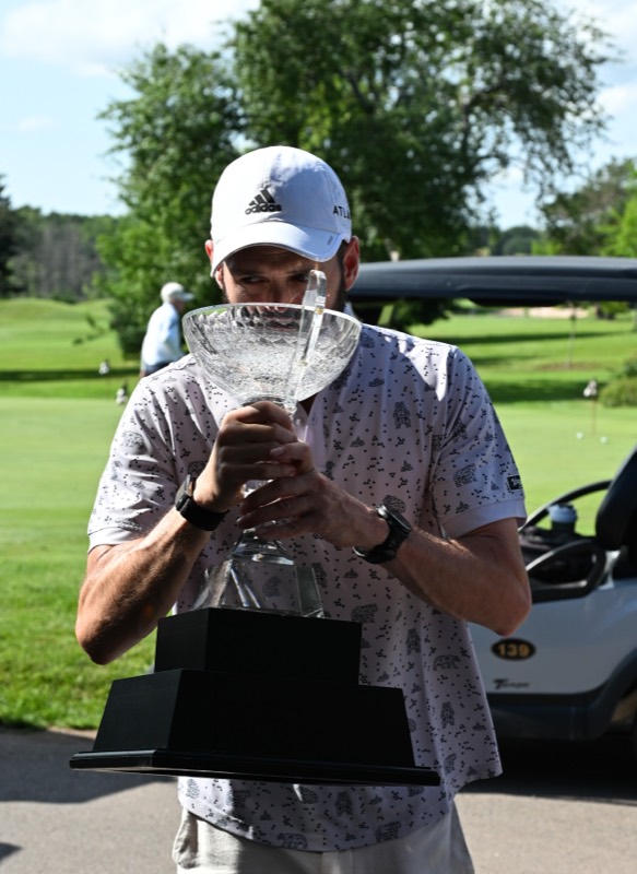 A Bears player holding the cup and drinking from it