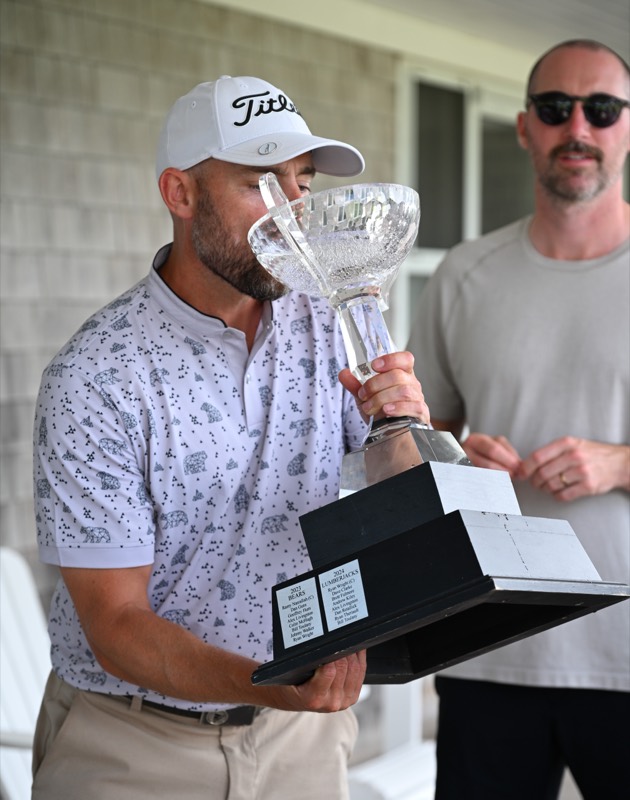 A Bears player raising the cup to drink from it